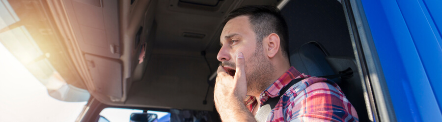 drowsy truck driver yawning
