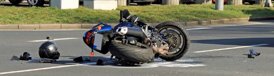 Motorcycle crash on road