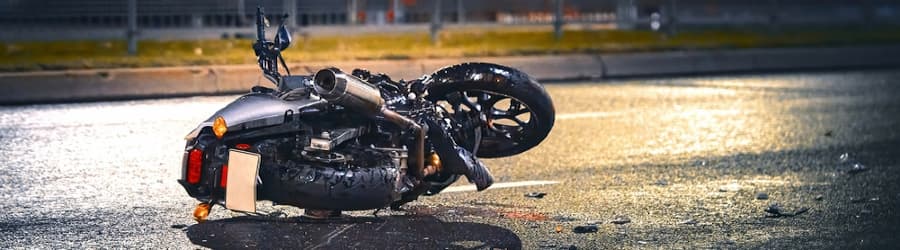 motorcycle lying on asphalt